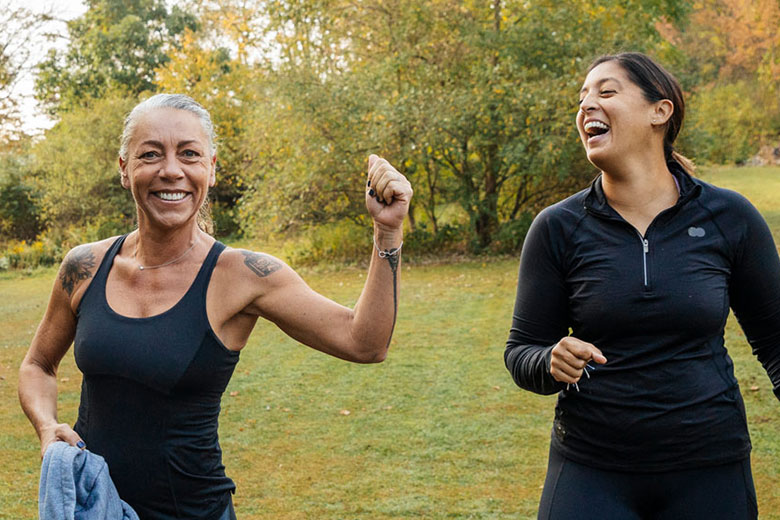 Two women exercising outside