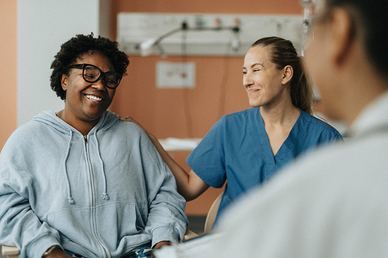 Female patient speaking to healthcare providers